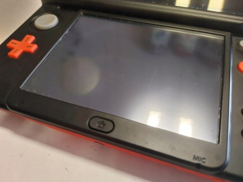 KONSOLA NEW NINTENDO 3DS XL POMARAŃCZOWO-CZARNA + RYSIK + ŁADOWARKA KONSOLA NEW NINTENDO 3DS XL POMARAŃCZOWO-CZARNA + RYSIK + ŁADOWARKA