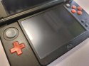 KONSOLA NEW NINTENDO 3DS XL POMARAŃCZOWO-CZARNA + RYSIK + ŁADOWARKA