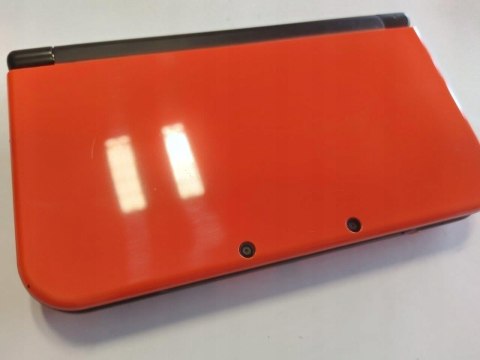KONSOLA NEW NINTENDO 3DS XL POMARAŃCZOWO-CZARNA + RYSIK + ŁADOWARKA KONSOLA NEW NINTENDO 3DS XL POMARAŃCZOWO-CZARNA + RYSIK + ŁADOWARKA