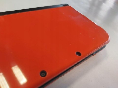 KONSOLA NEW NINTENDO 3DS XL POMARAŃCZOWO-CZARNA + RYSIK + ŁADOWARKA KONSOLA NEW NINTENDO 3DS XL POMARAŃCZOWO-CZARNA + RYSIK + ŁADOWARKA