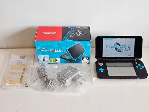 ZADBANA KONSOLA NEW NINTENDO 2DS XL NIEBIESKO-CZARNA + ŁADOWARKA + PUDEŁKO ZADBANA KONSOLA NEW NINTENDO 2DS XL NIEBIESKO-CZARNA + ŁADOWARKA + PUDEŁKO