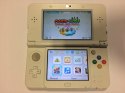 KONSOLA NEW NINTENDO 3DS BIAŁA + ŁADOWARKA + RYSIK + GRA MARIO