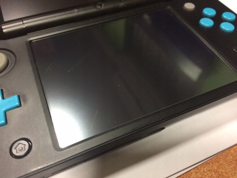 KONSOLA NEW NINTENDO 2DS XL NIEBIESKO-CZARNA + ŁADOWARKA + RYSIK + ETUI