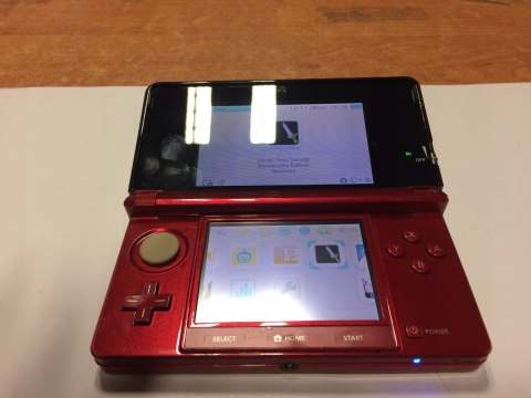 KONSOLA NINTENDO 3DS CZERWONA + ŁADOWARKA + ZELDA