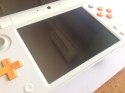 KONSOLA NEW NINTENDO 2DS XL BIAŁO-POMARAŃCZKOWA + USB + RYSIK