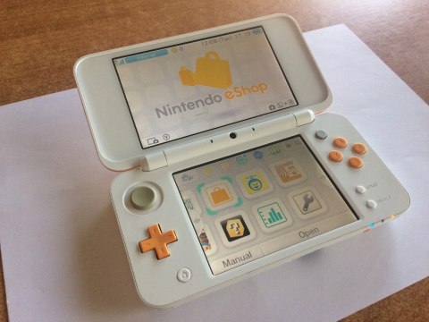 KONSOLA NEW NINTENDO 2DS XL BIAŁO-POMARAŃCZOWA + ŁADOWARKA +RYSIK + PUDEŁKO