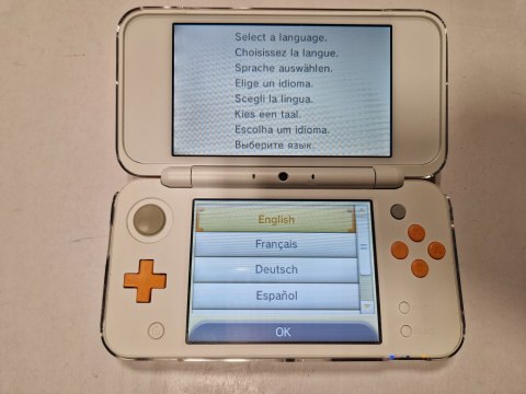 KONSOLA NEW NINTENDO 2DS XL BIAŁO-POMARAŃCZKOWA + RYSIK