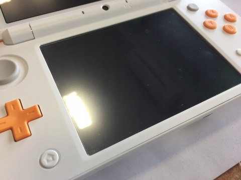 ŁADNA KONSOLA NEW NINTENDO 2DS XL BIAŁO-POMARAŃCZKOWA + RYSIK