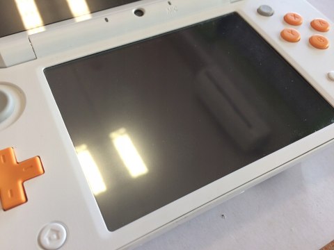 ŁADNA KONSOLA NEW NINTENDO 2DS XL BIAŁO-POMARAŃCZKOWA + RYSIK