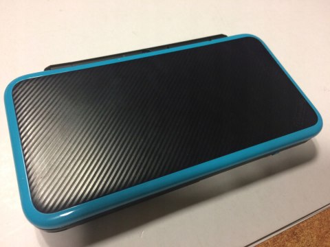 KONSOLA NEW NINTENDO 2DS XL NIEBIESKO-CZARNA + ŁADOWARKA + PUDEŁKO