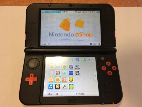 KONSOLA NEW NINTENDO 3DS XL POMARAŃCZOWO-CZARNA + ETUI PIKACHU + RYSIK +ŁAD