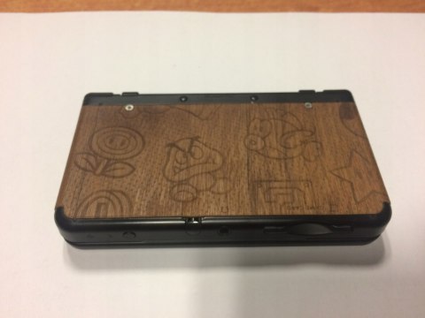 KONSOLA NEW NINTENDO 3DS CZARNA + 4 GRY + COVER PLATE' ALA DREWNO + PUDEŁKO