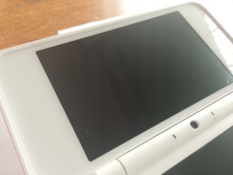 KONSOLA NEW NINTENDO 2DS XL BIAŁO-POMARAŃCZKOWA + RYSIK + PUDEŁKO