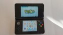 KONSOLA NEW NINTENDO 3DS CZARNA + 4 GRY ( W TYM 3 POKEMONY ) + RYSIK + ŁAD