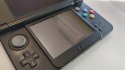 KONSOLA NEW NINTENDO 3DS CZARNA + 4 GRY ( W TYM 3 POKEMONY ) + RYSIK + ŁAD