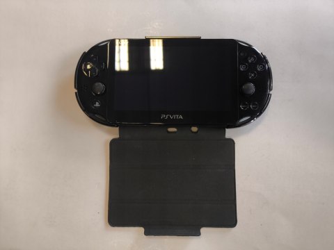 KONSOLA SONY PS VITA SLIM MODEL 2004 + ŁADOWARKA + PUDEŁKO + ETUI KONSOLA SONY PS VITA SLIM MODEL 2004 + ŁADOWARKA + PUDEŁKO + ETUI