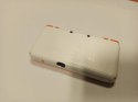 KONSOLA NEW NINTENDO 2DS XL POMARAŃCZOWO-BIAŁA + ŁAD + ETUI